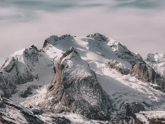 Snow-covered mountain peaks beneath a clear sky